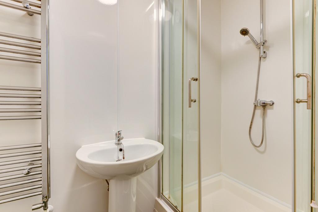 A clean and well-maintained bathroom featuring ...