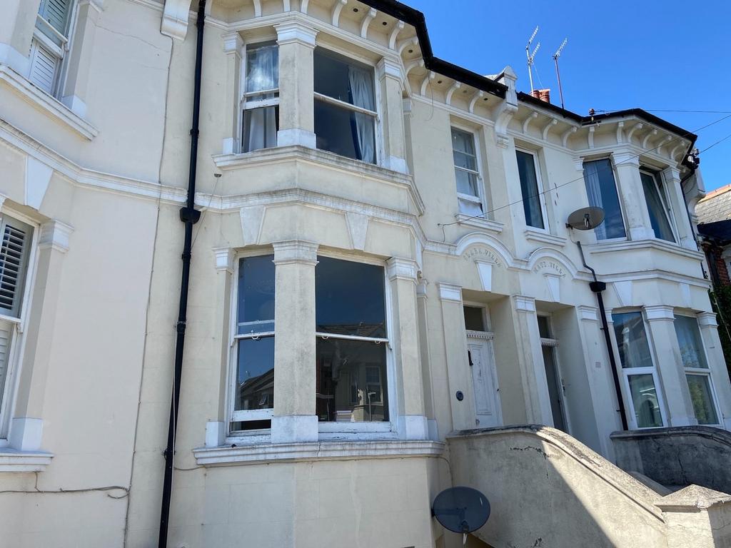 A charming front exterior of a classic terraced...