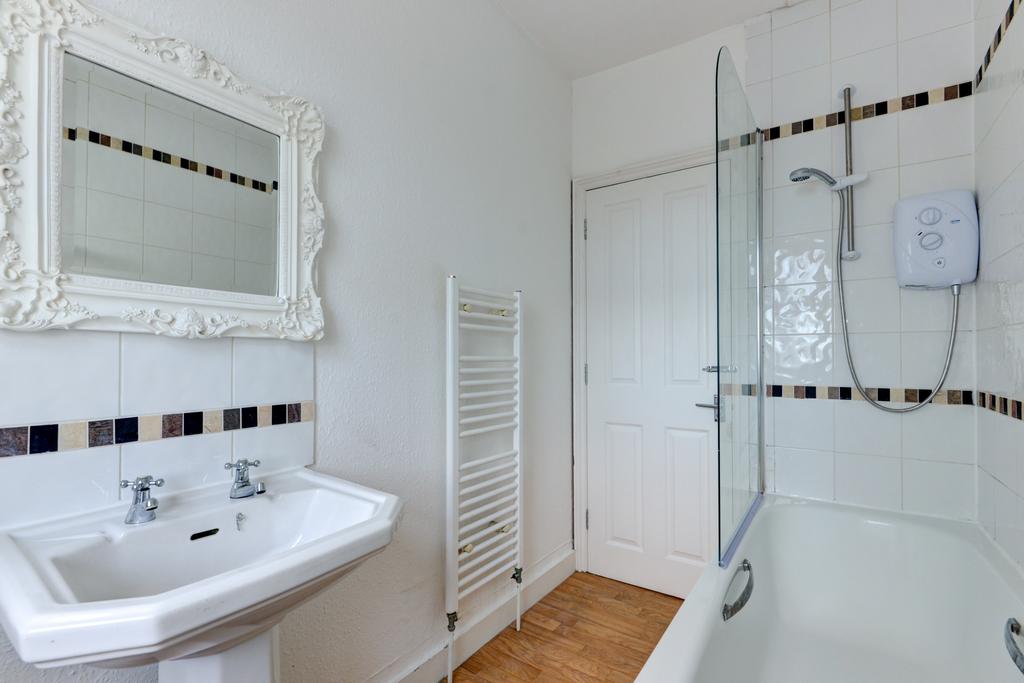 A clean, well-maintained bathroom featuring a s...