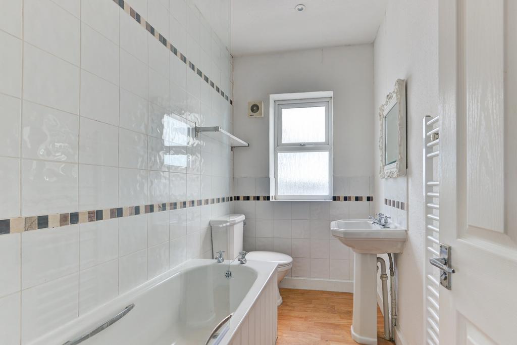 Bright and clean bathroom featuring a spacious ...