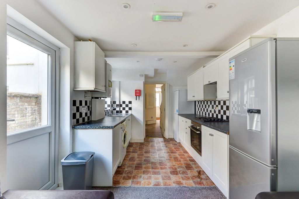 Bright and functional kitchen with ample natura...