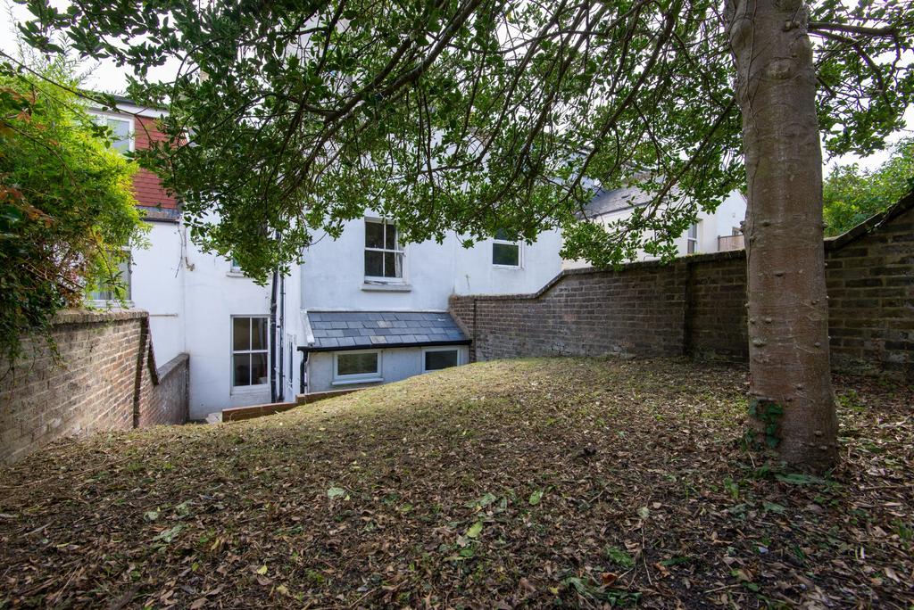 A charming front exterior view of a residential...