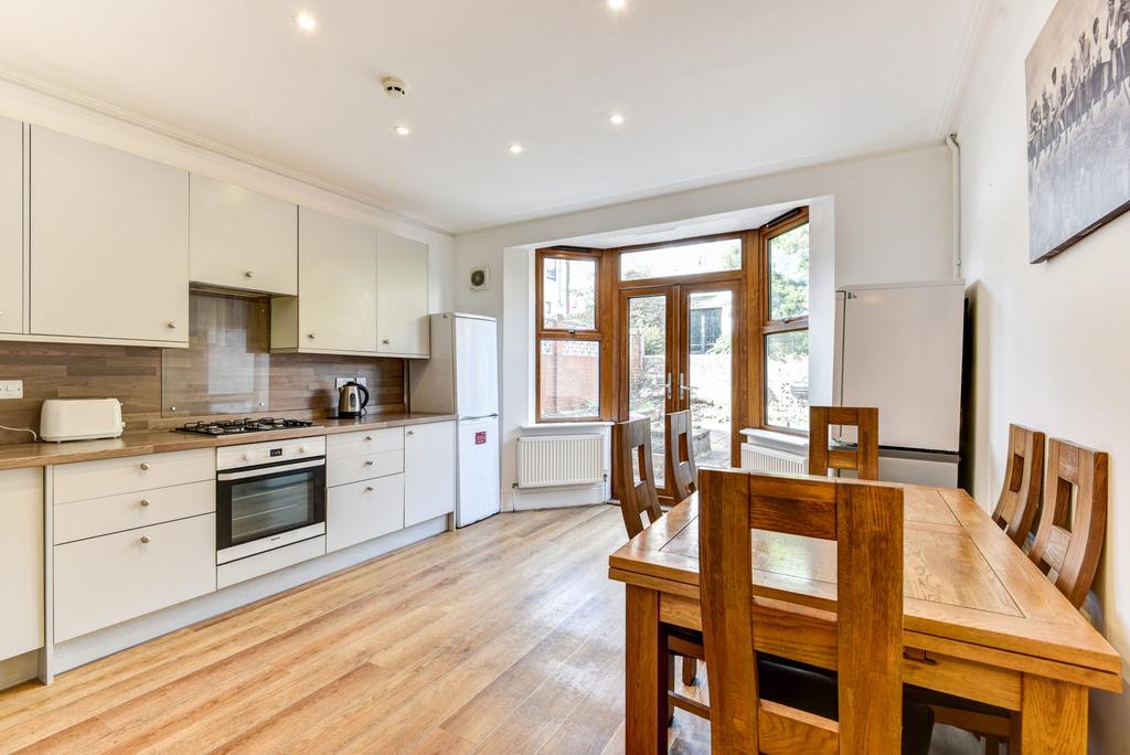 A bright and welcoming living area with ample n...