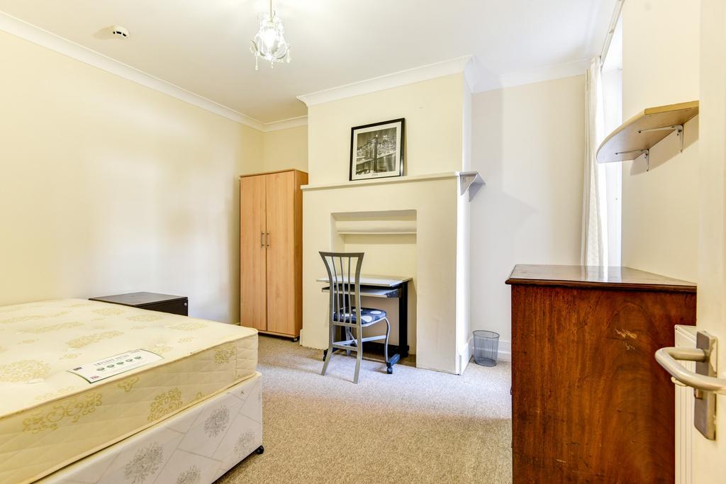 A bright and spacious master bedroom featuring ...