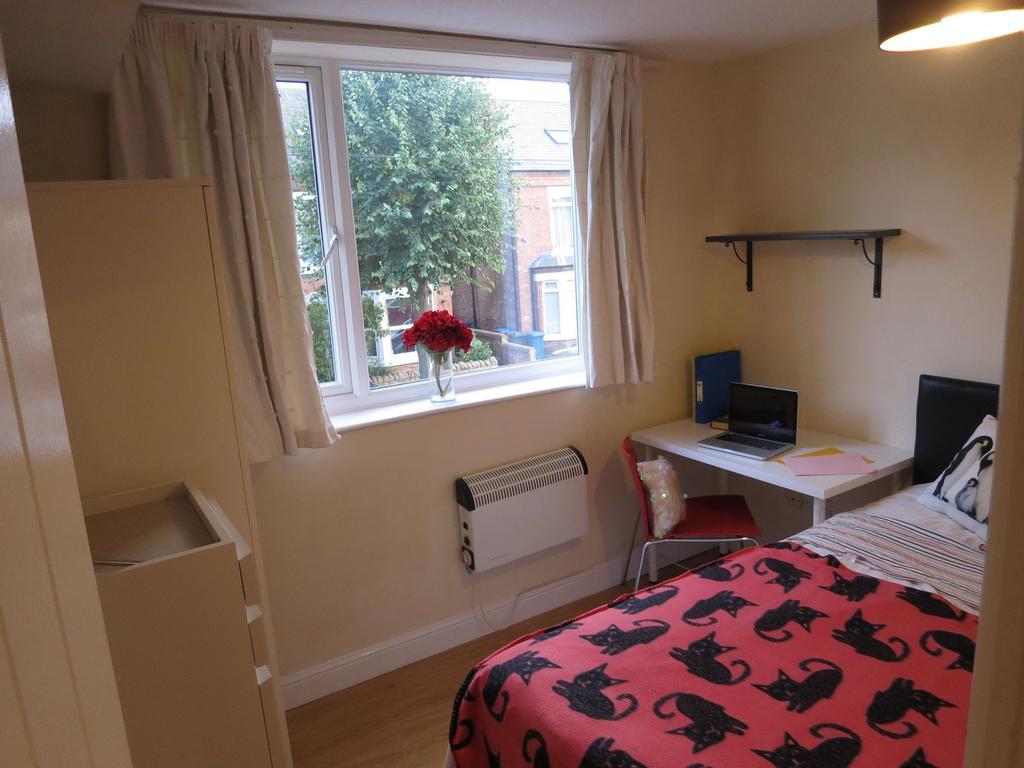 Bright, tidy single bedroom with a large window...