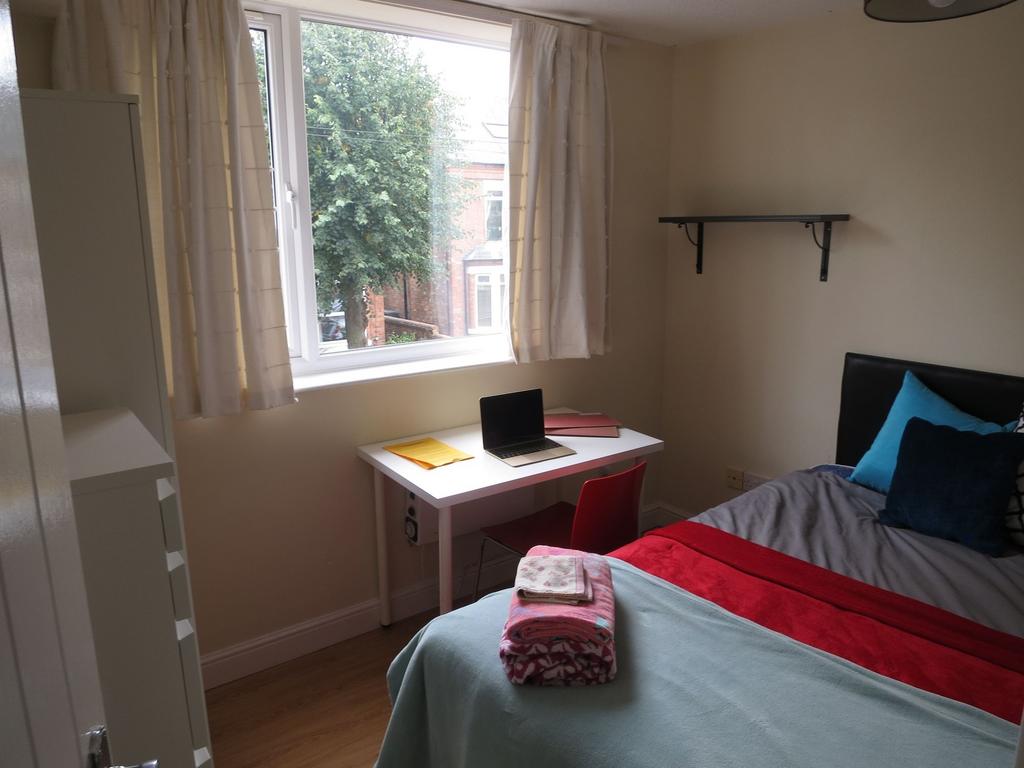 Bright, well-kept bedroom with a comfy double b...