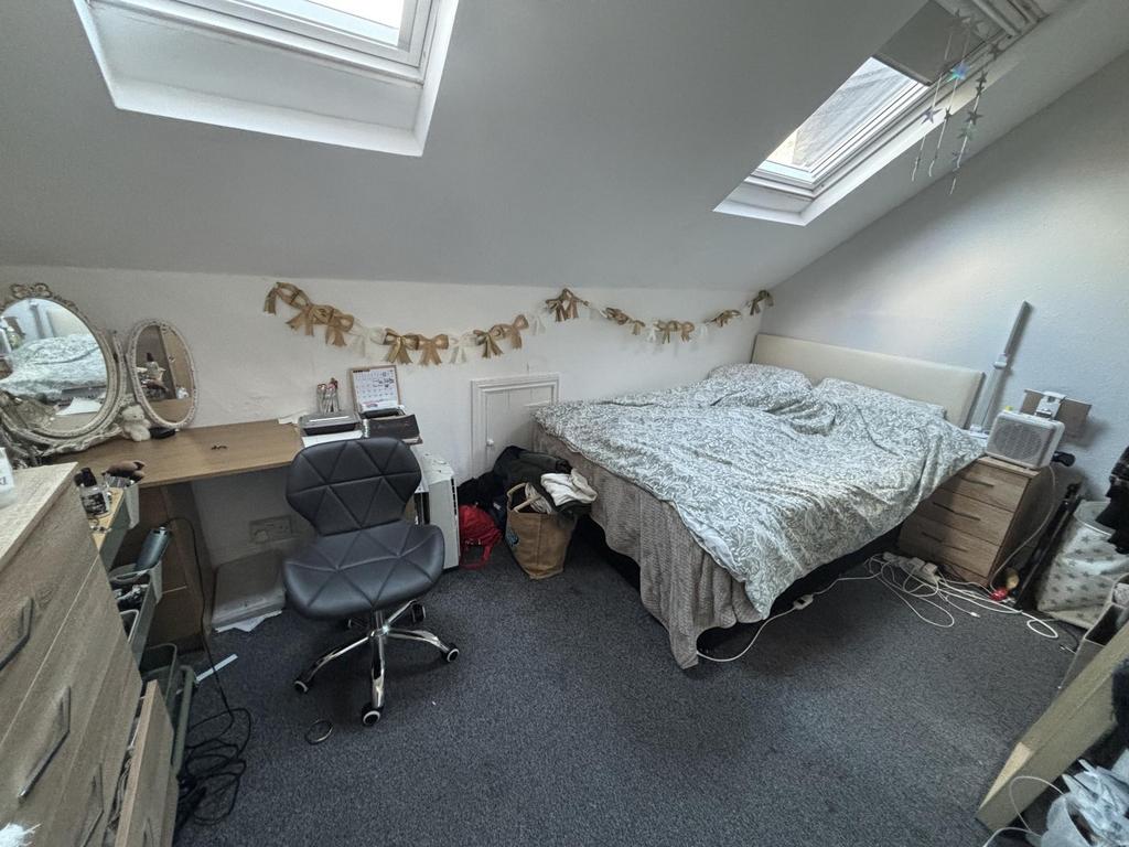 Bright attic double bedroom with two skylight w...