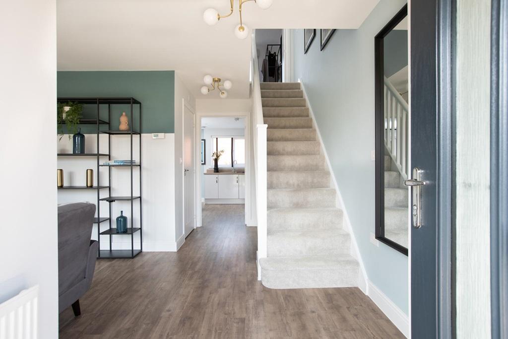 The entrance hall is flooded with natural light...
