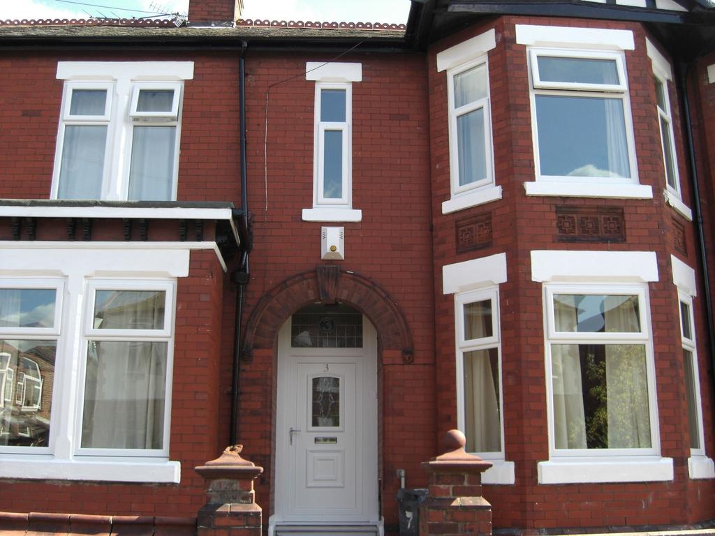 Exterior view of a charming red brick house wit...