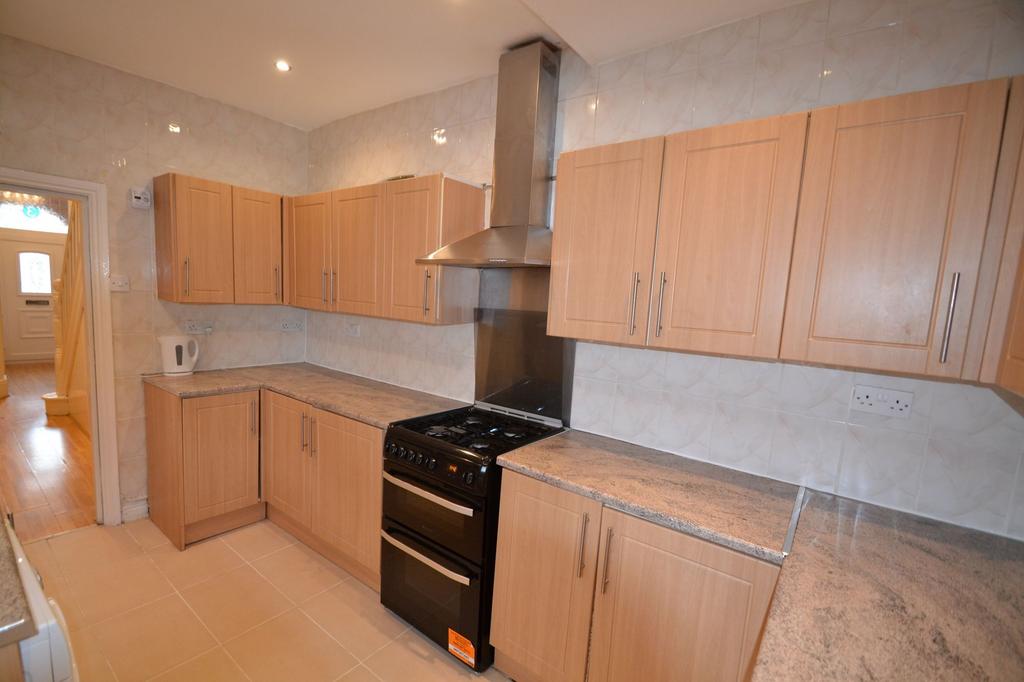 A well-maintained kitchen featuring wooden cabi...