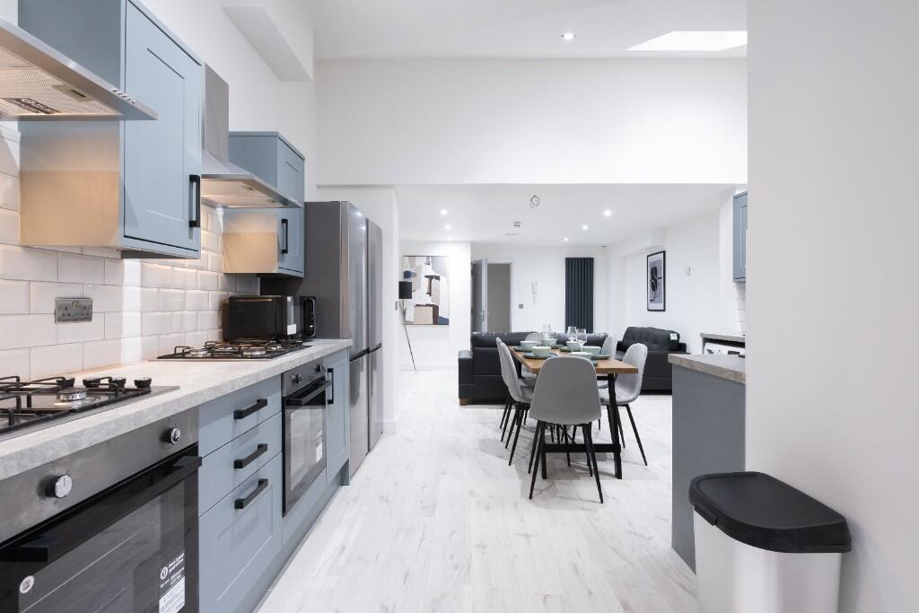 A modern, well-lit kitchen with sleek cabinetry...