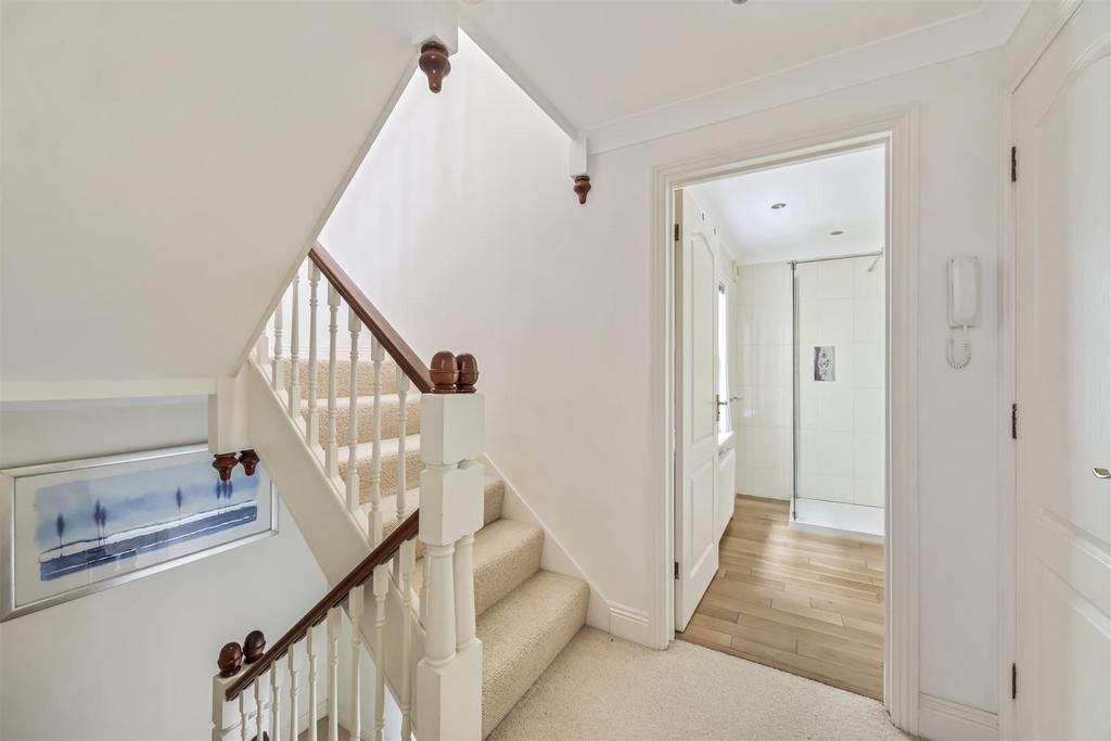 Stairs rising to Second Floor