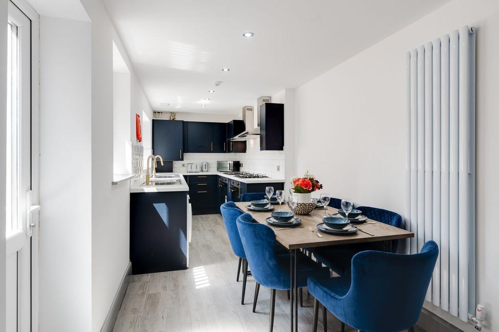 Bright modern kitchen-diner with a sleek island...