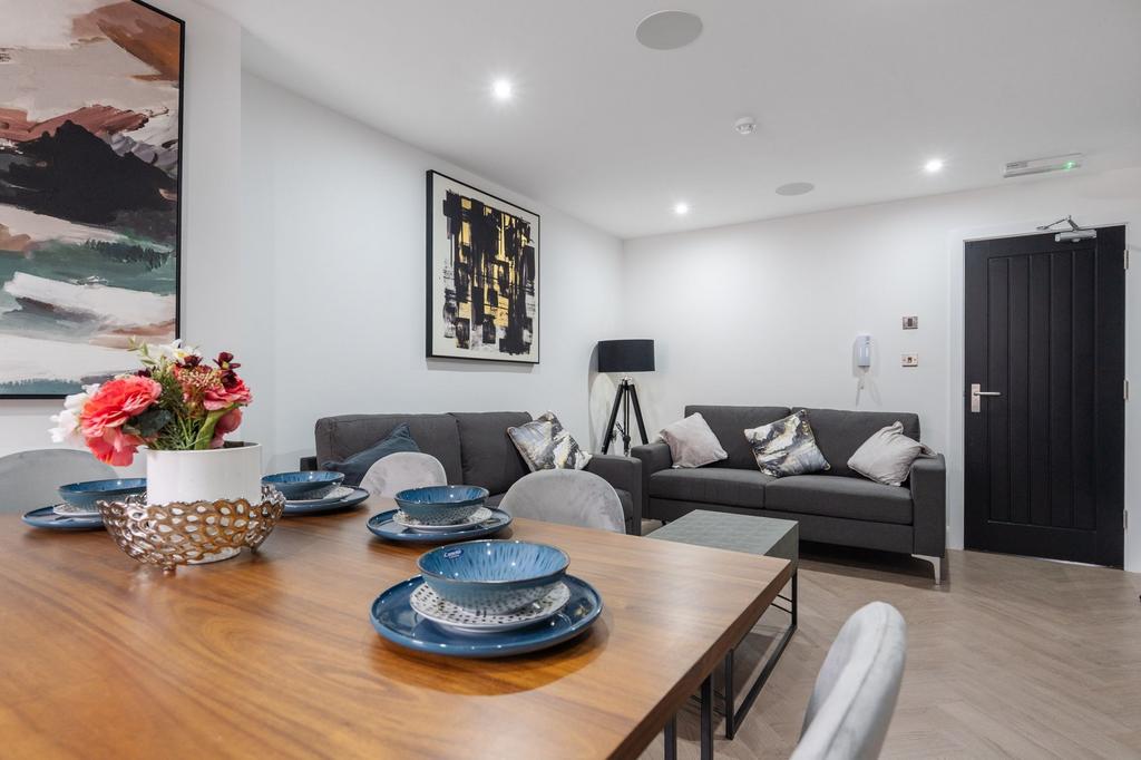 A modern, well-lit living room featuring sleek ...