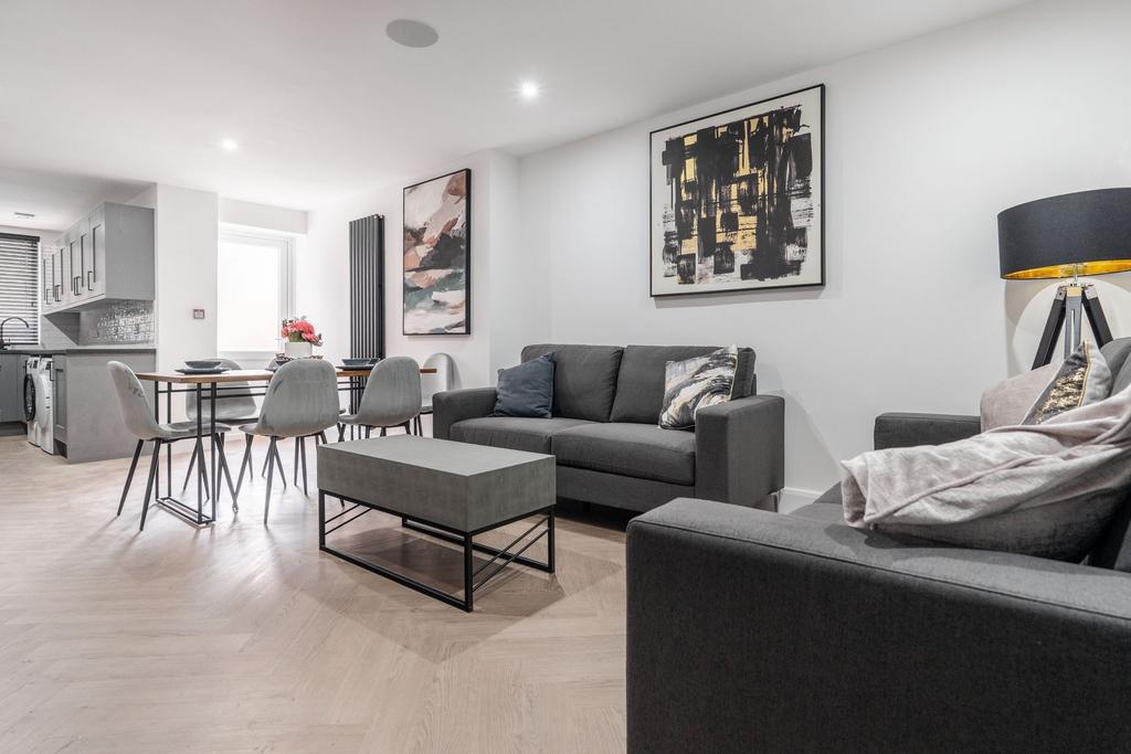 Modern, well-lit living room featuring stylish ...