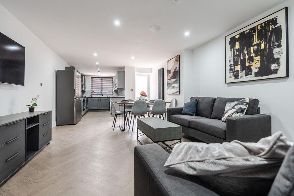 Spacious, modern living area with contemporary ...