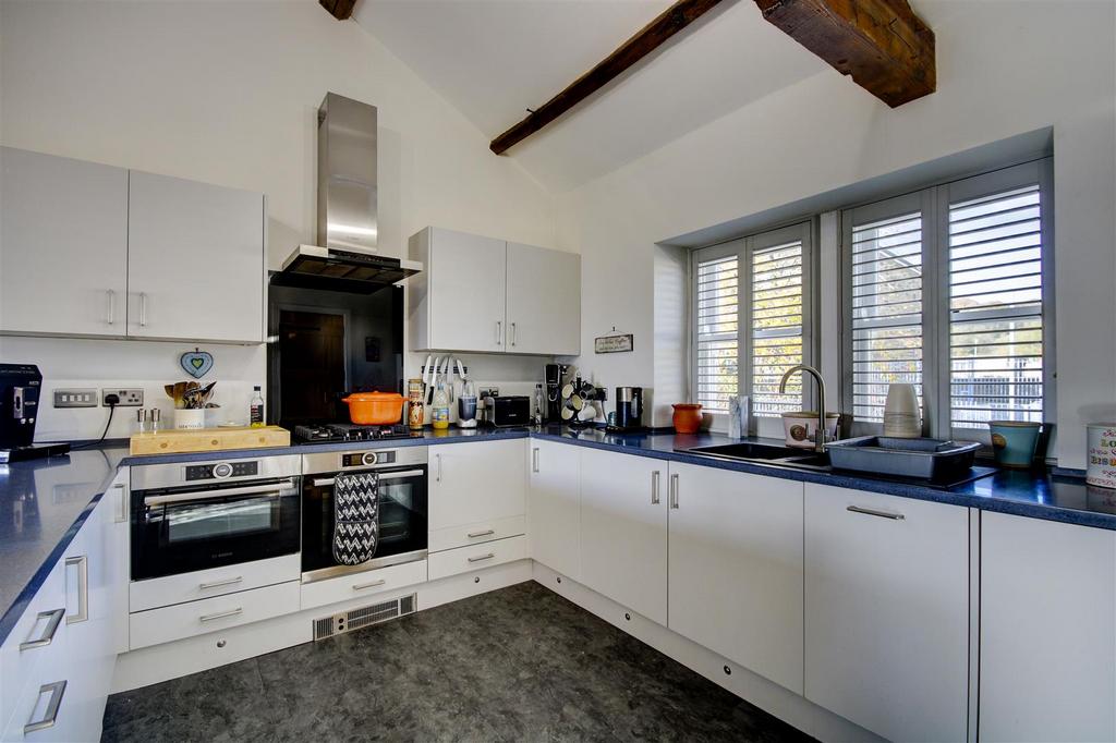 Modern fitted kitchen with underlighting