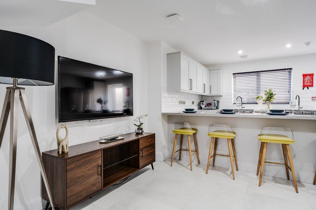 Bright and modern kitchen with ample counter sp...