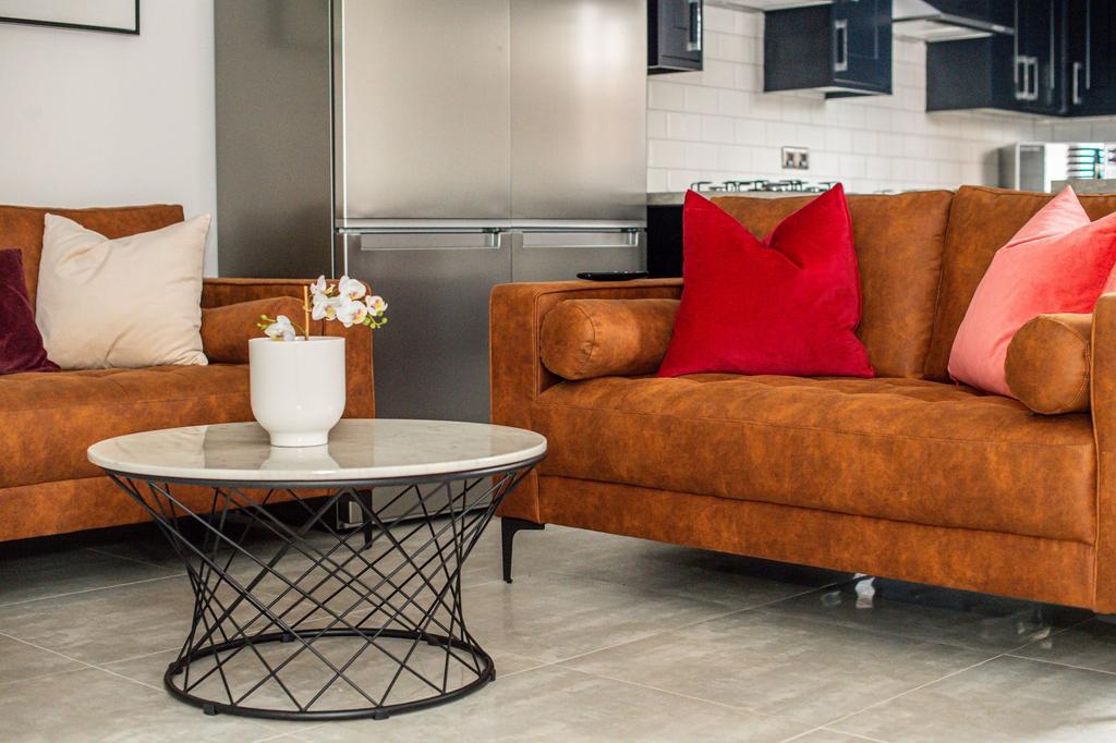 A modern and stylish living room featuring comf...