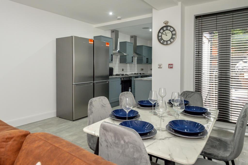 Modern, well-maintained kitchen featuring a din...
