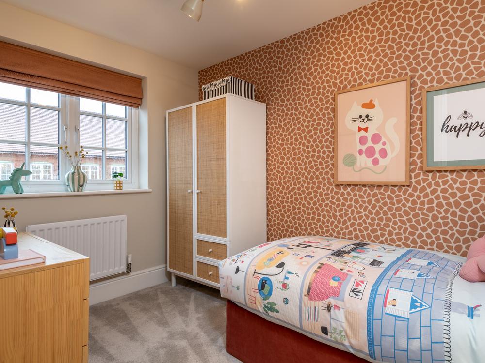 Bedroom 3 interior designed with soft pink and...