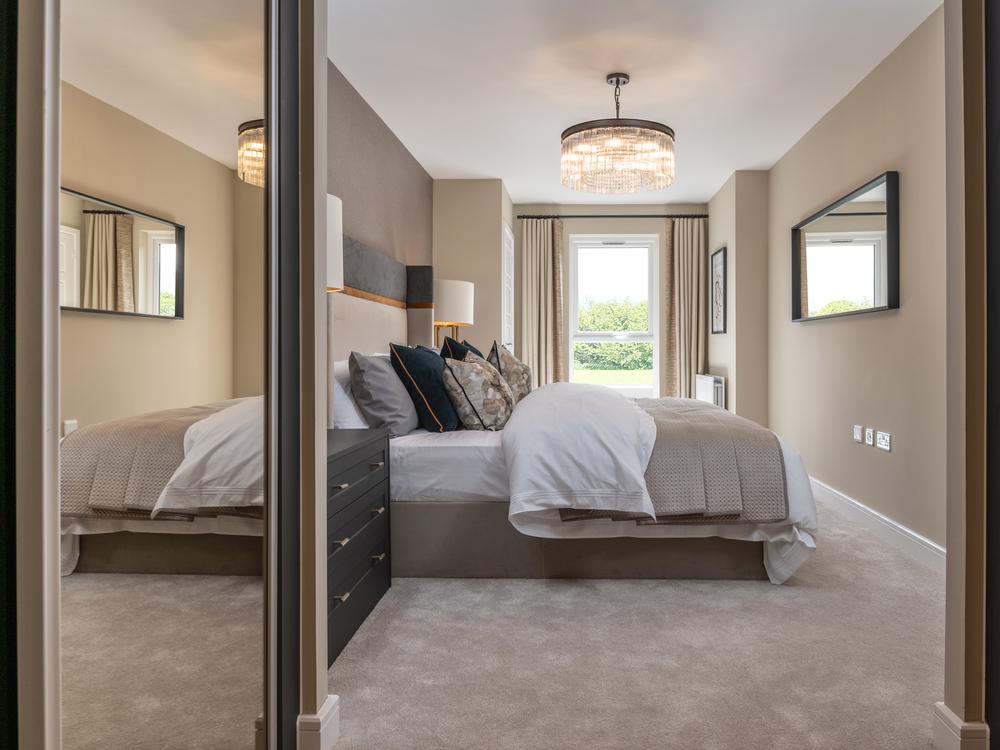 An image of the main bedroom with sliding...