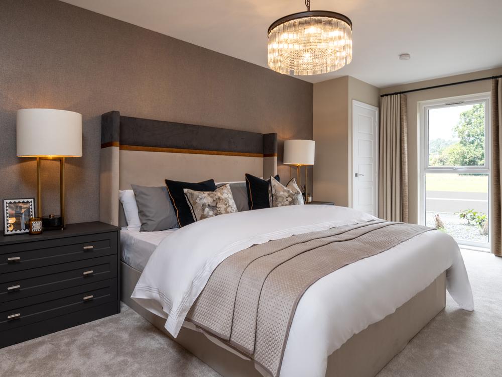 Image of bedroom with chest side table, and...