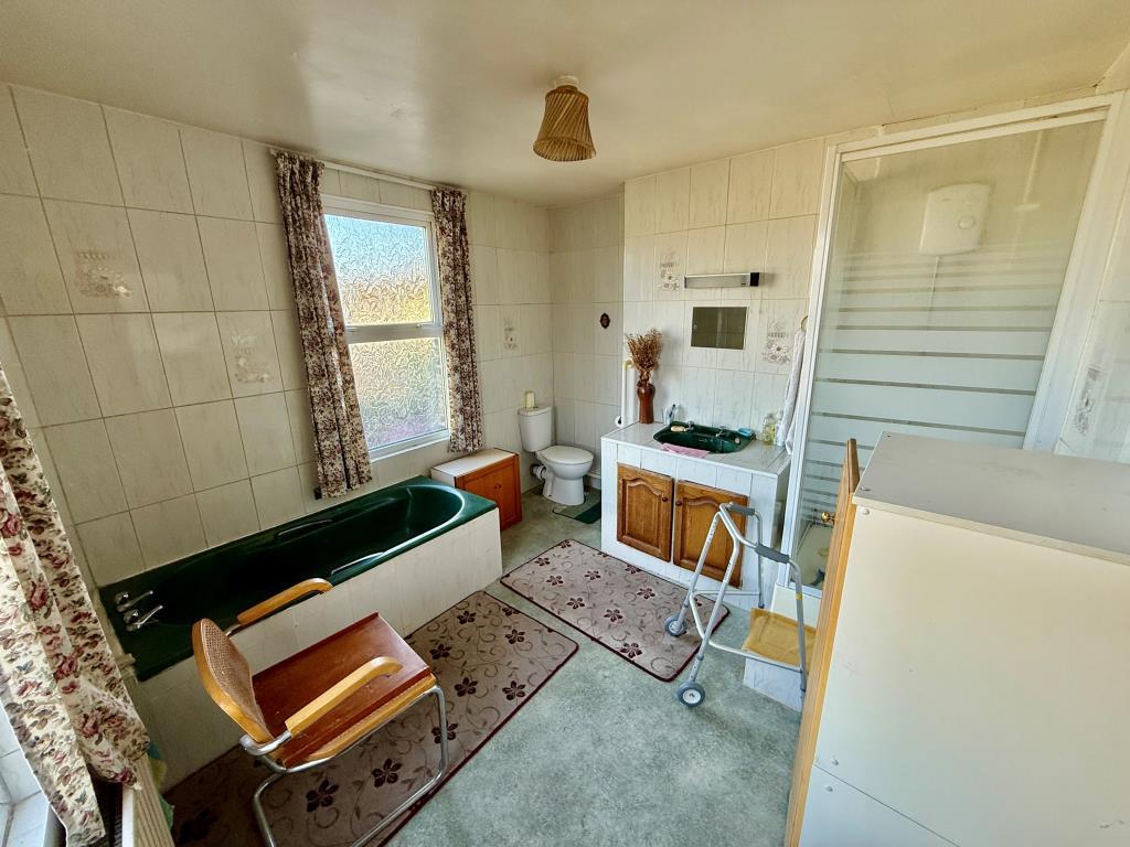 Maisonette bathroom with shower and W.C.