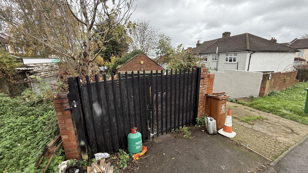 External image of garage and yard with gates close