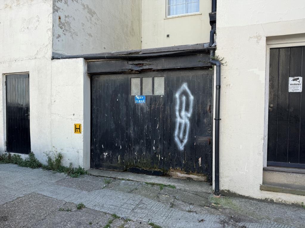 Lock-up garage with wooden door