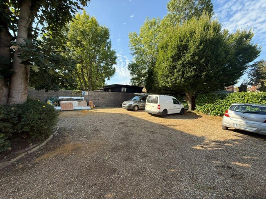 Shared gravel parking area
