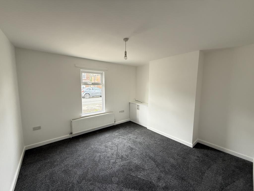 Smooth painted white walls and grey carpet
