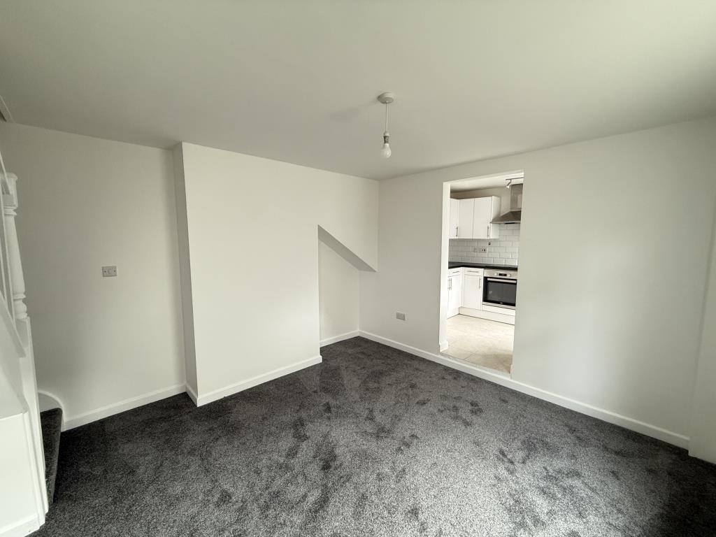 Dining room with kitchen and stairs in view