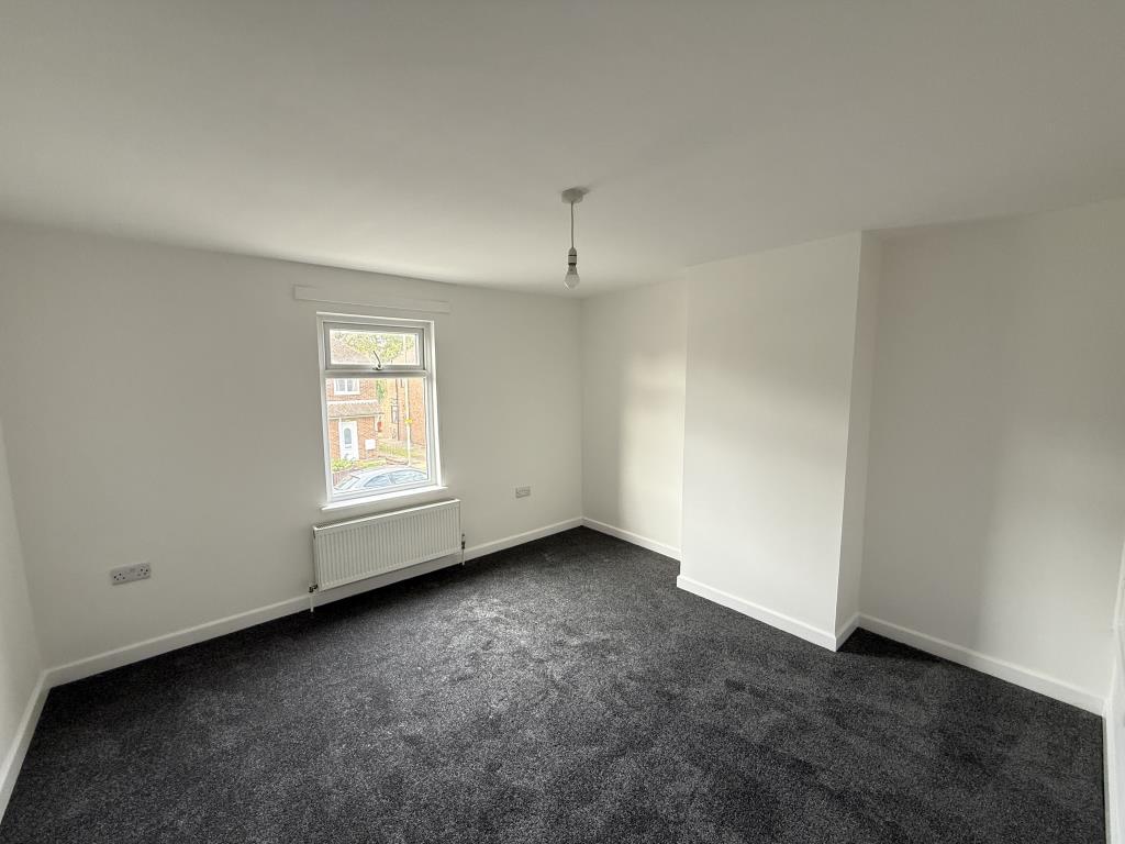Bedroom with view onto road