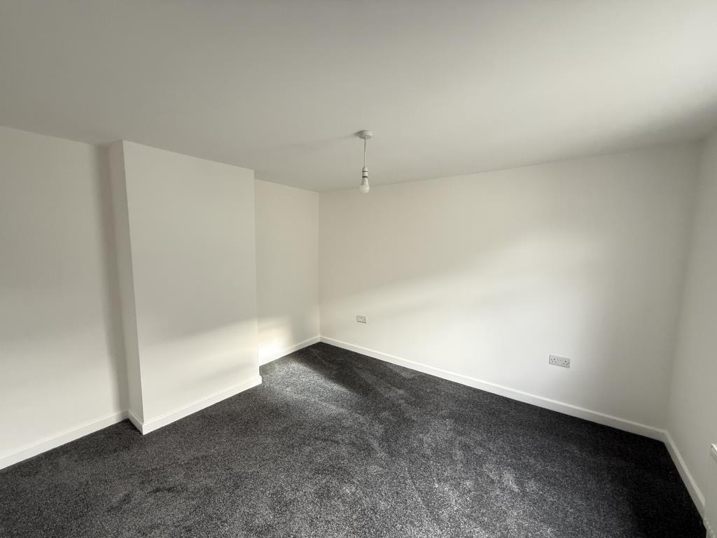 Smooth painted white walls and grey carpet