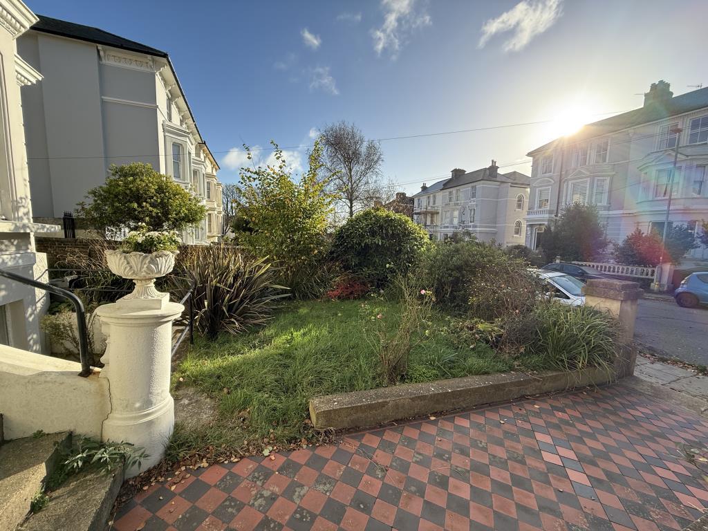 Front garden with flower bed and lawn