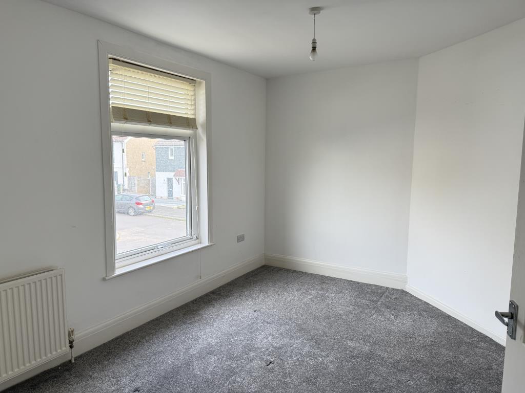 Bedroom one with white walls and grey carpet