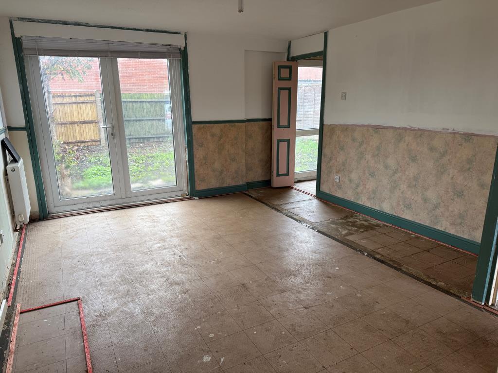 Living room with double doors to rear garden