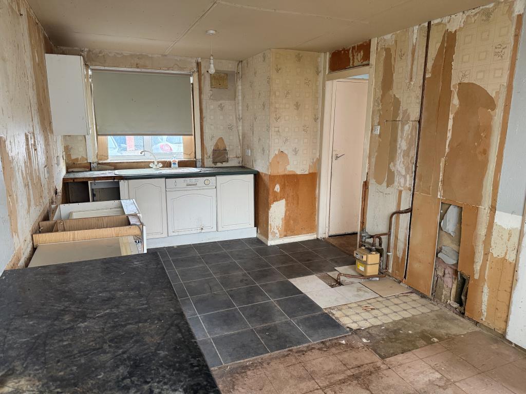 Kitchen with units removed and front window