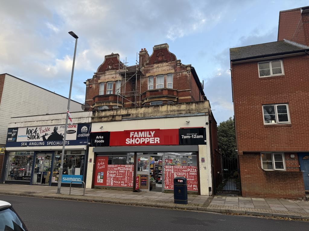 Mixed use building with commercial unit on ground