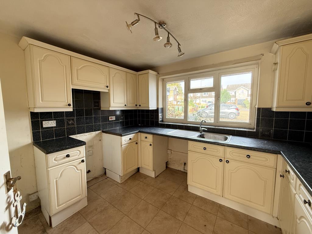 Fitted kitchen looking onto driveway