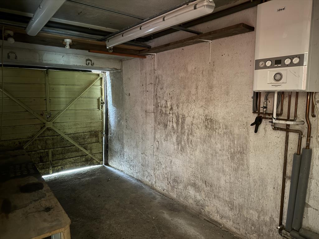 Internal view of garage with wall mounted boiler