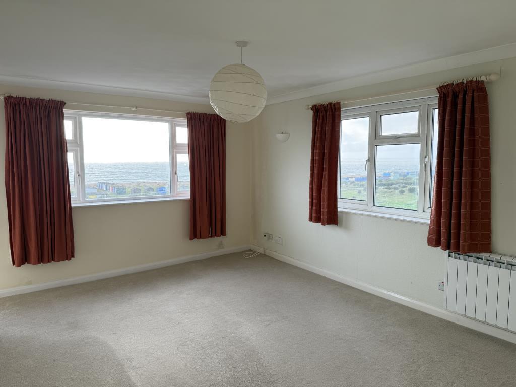 Living room with fitted carpet and painted walls