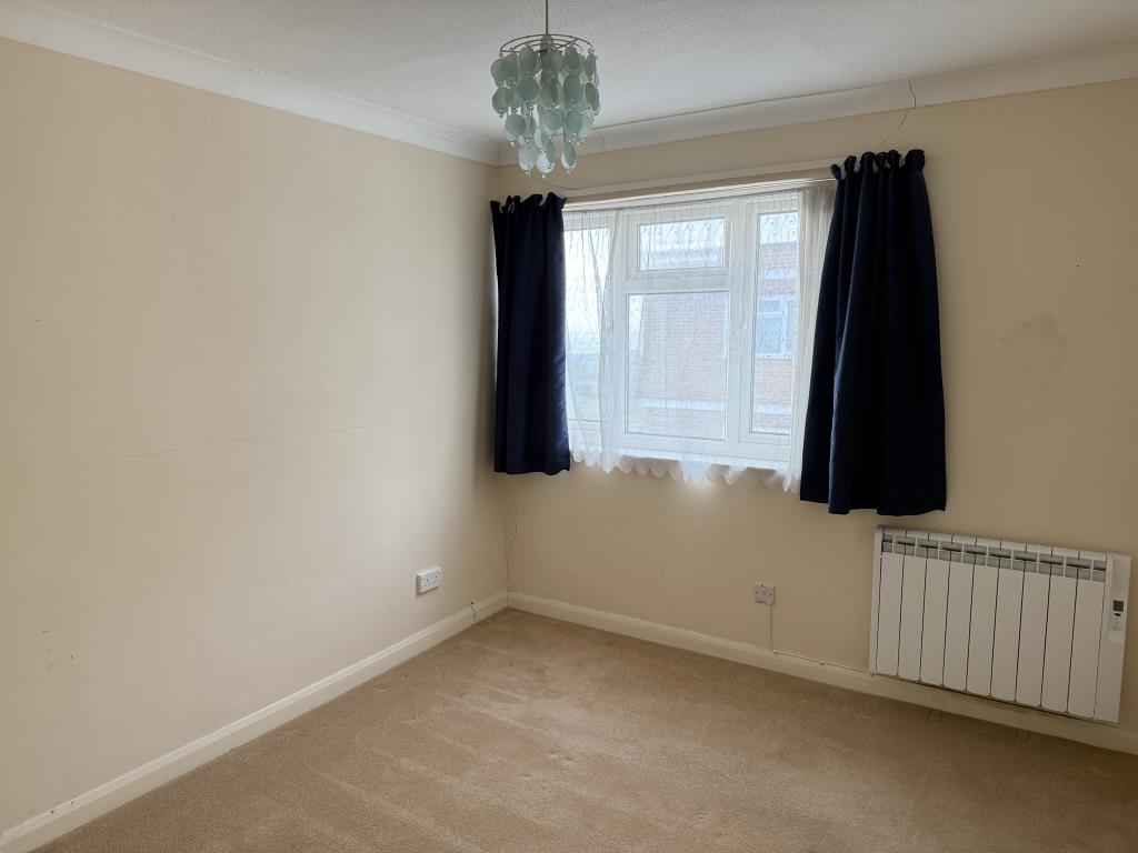 Bedroom two with fitted carpet and painted walls
