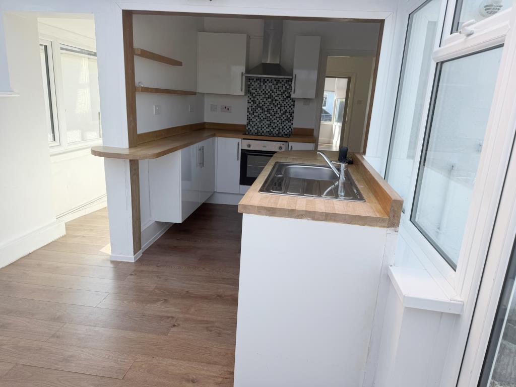 Kitchen to rear with fitted units