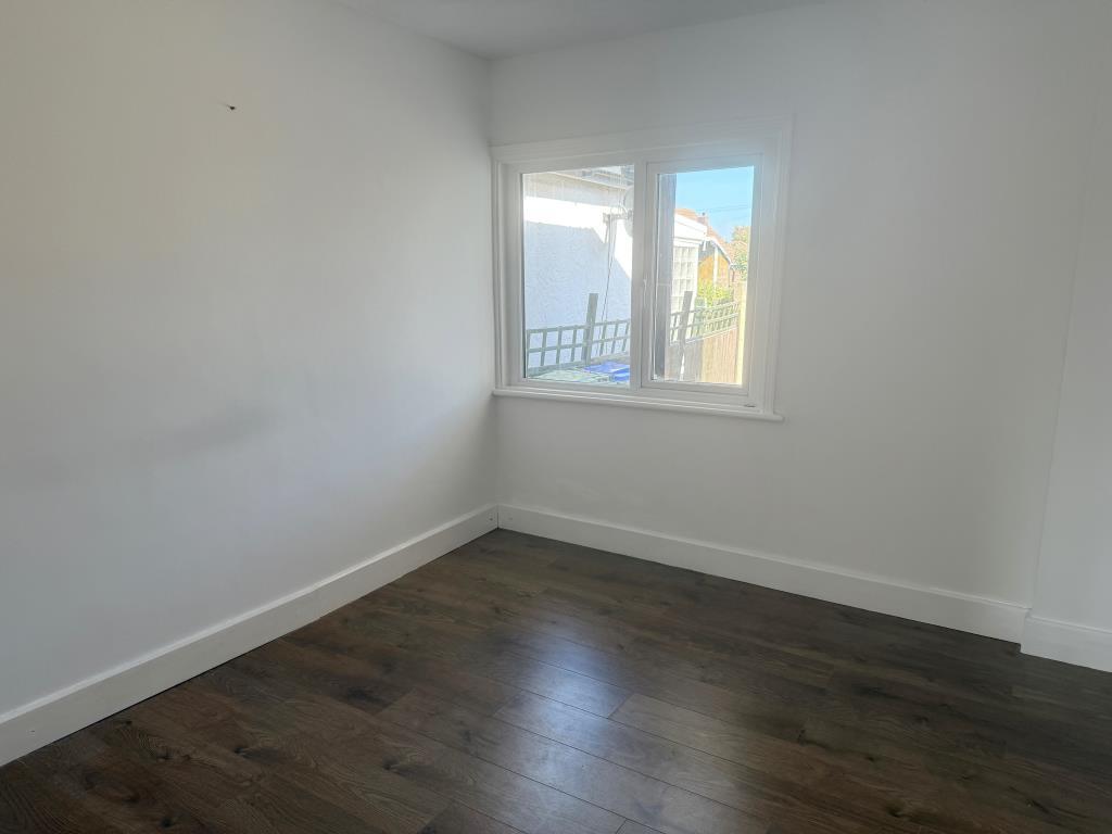 Bedroom 2 with window overlooking rear garden