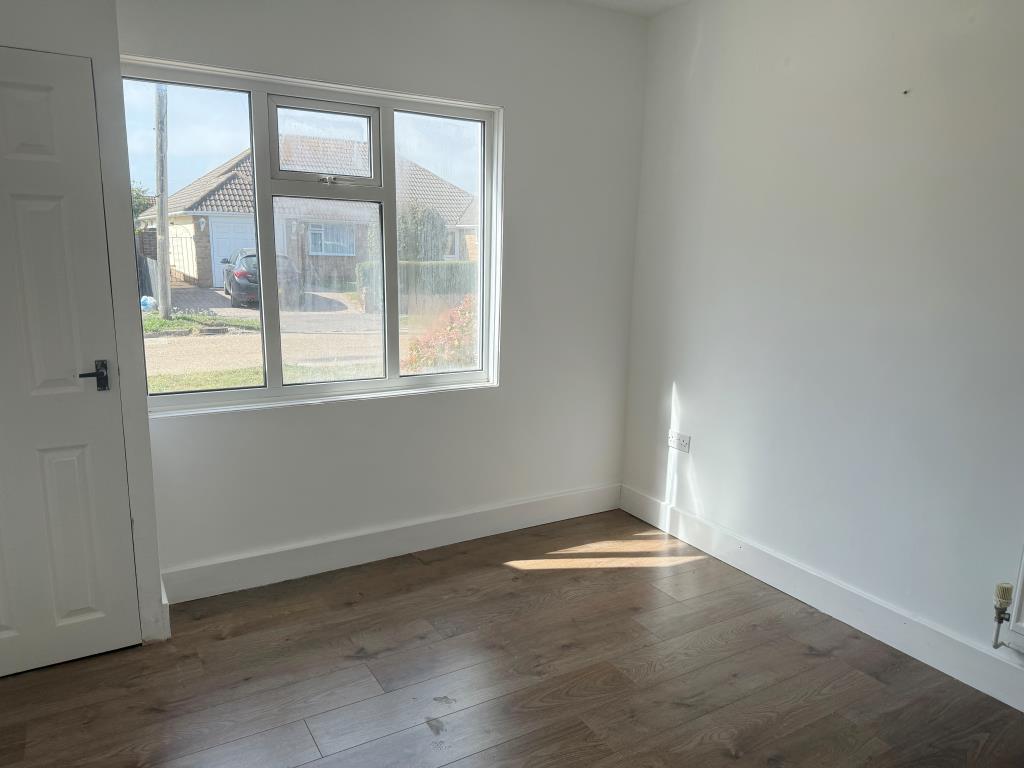 Bedroom 3 with window overlooking Slindon Avenue