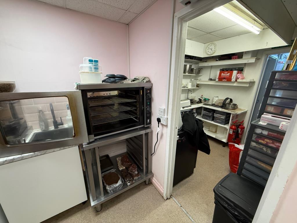 Kitchen and food prep area in the cafe