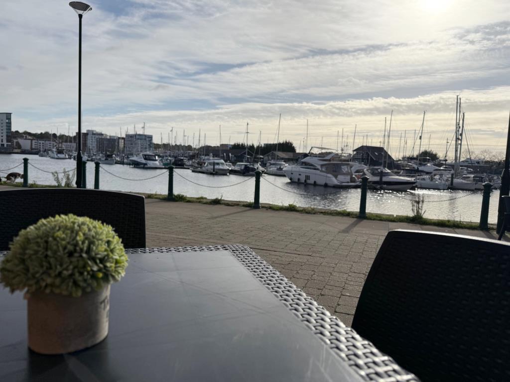 Outside table with view across the marina