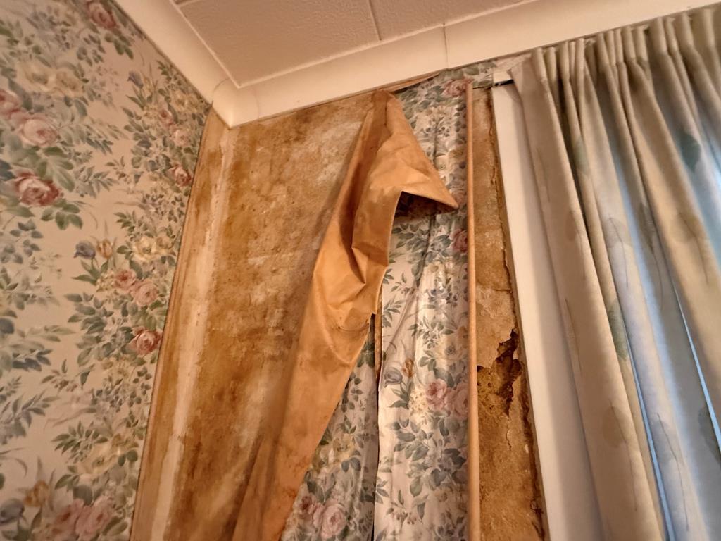 Shot of leak damage on bedroom wall